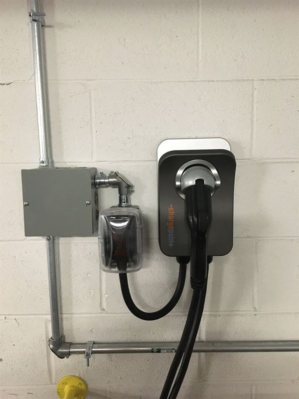 Level 2 EV charger installed in a condo parking garage