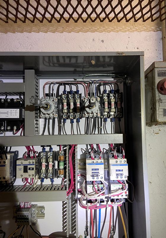 Open duplex pump control panel with motor contactors, overloads, fuses and an alternating relay